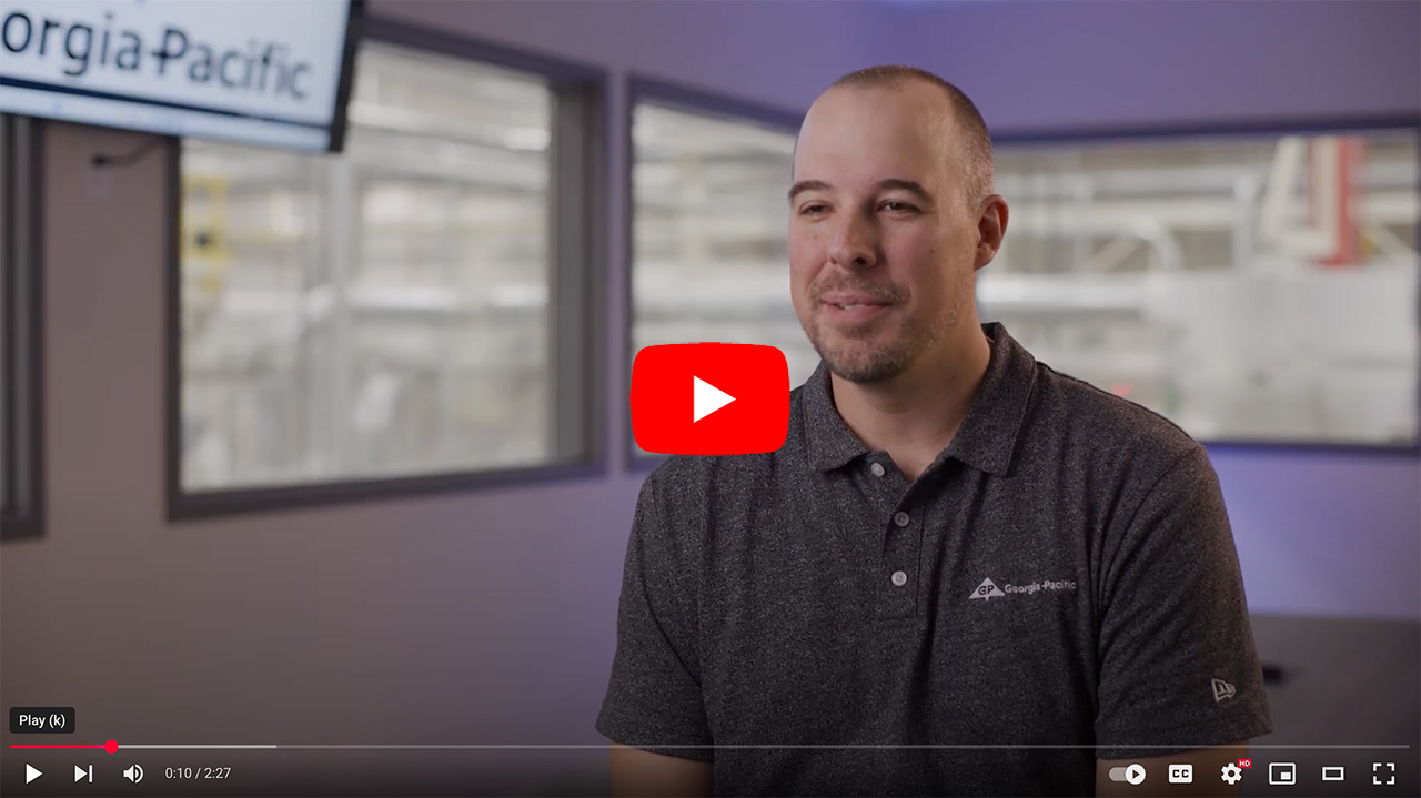 Employee interview at Georgia-Pacific showcasing insights on company culture and operations, with the interviewee speaking in a modern office setting.